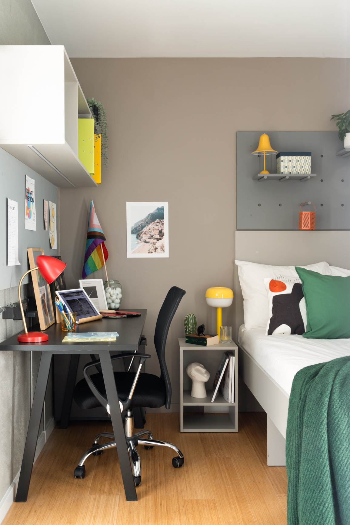 The Giant Apartment bed room with 140cm bed, ample shelving, bedside table and desk with chair in Basestack Living student accommodation and apartments to rent in Copenhagen
