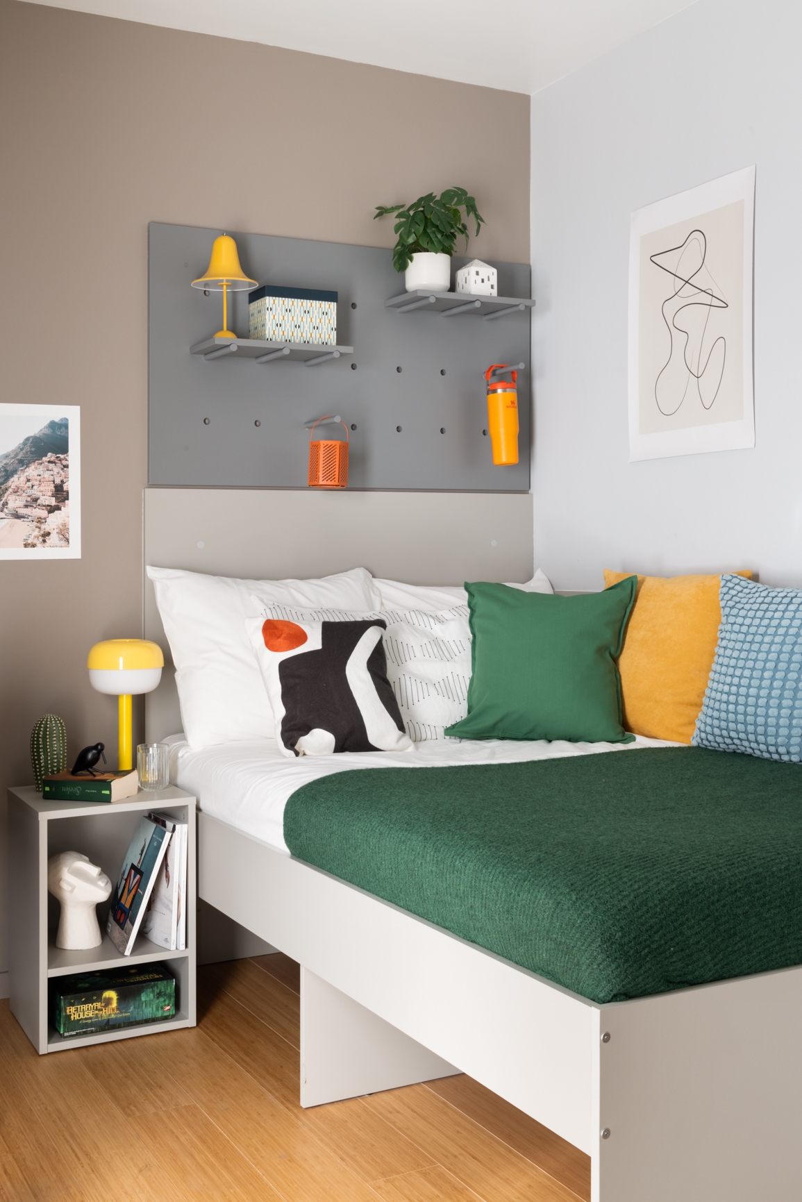 The Giant Apartment bed room with 140cm bed, ample shelving and bedside table in Basestack Living student accommodation and apartments to rent in Copenhagen
