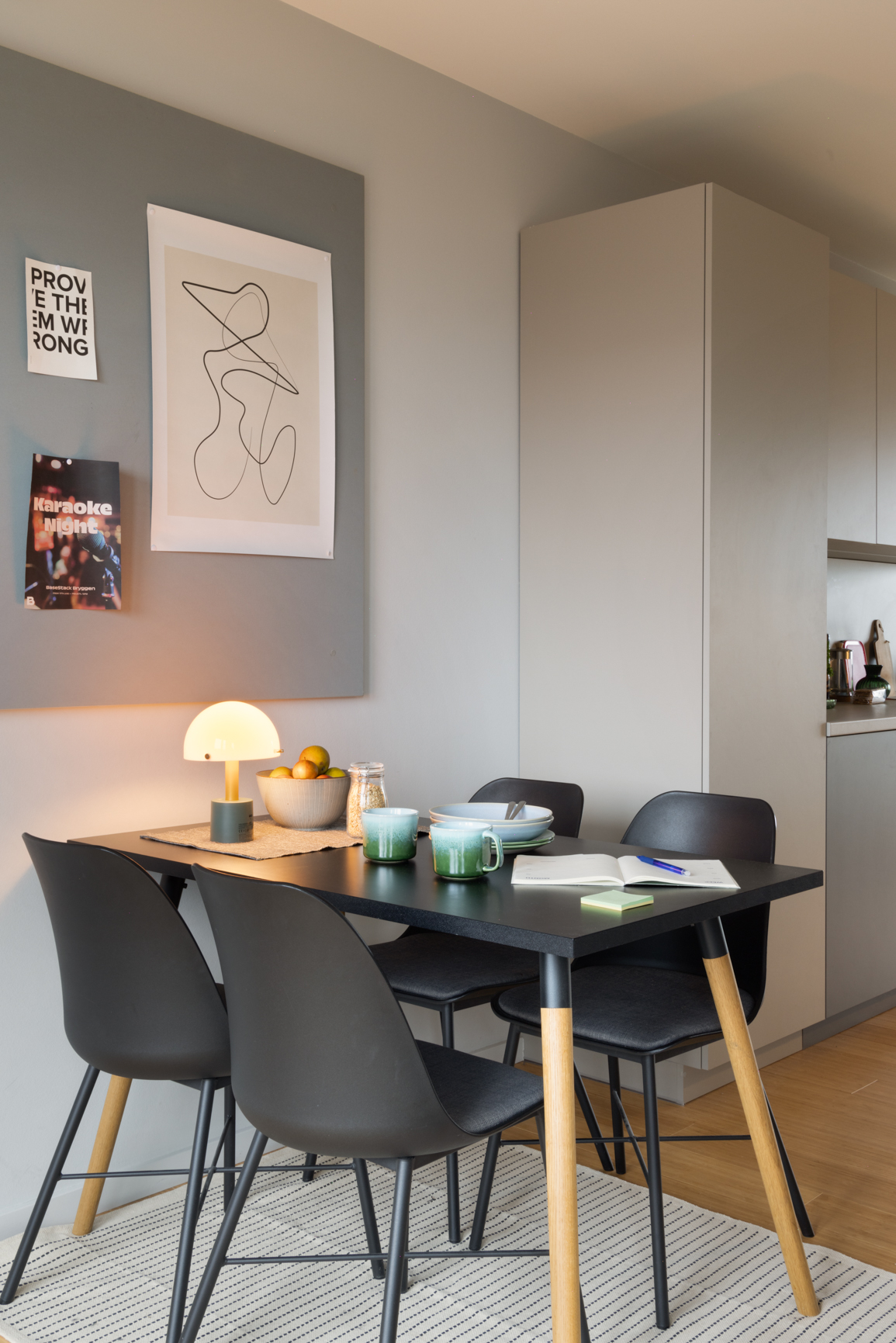 Big and bold apartment dining table with 4 chairs in Basestack Living student accommodation and apartments to rent in Copenhagen