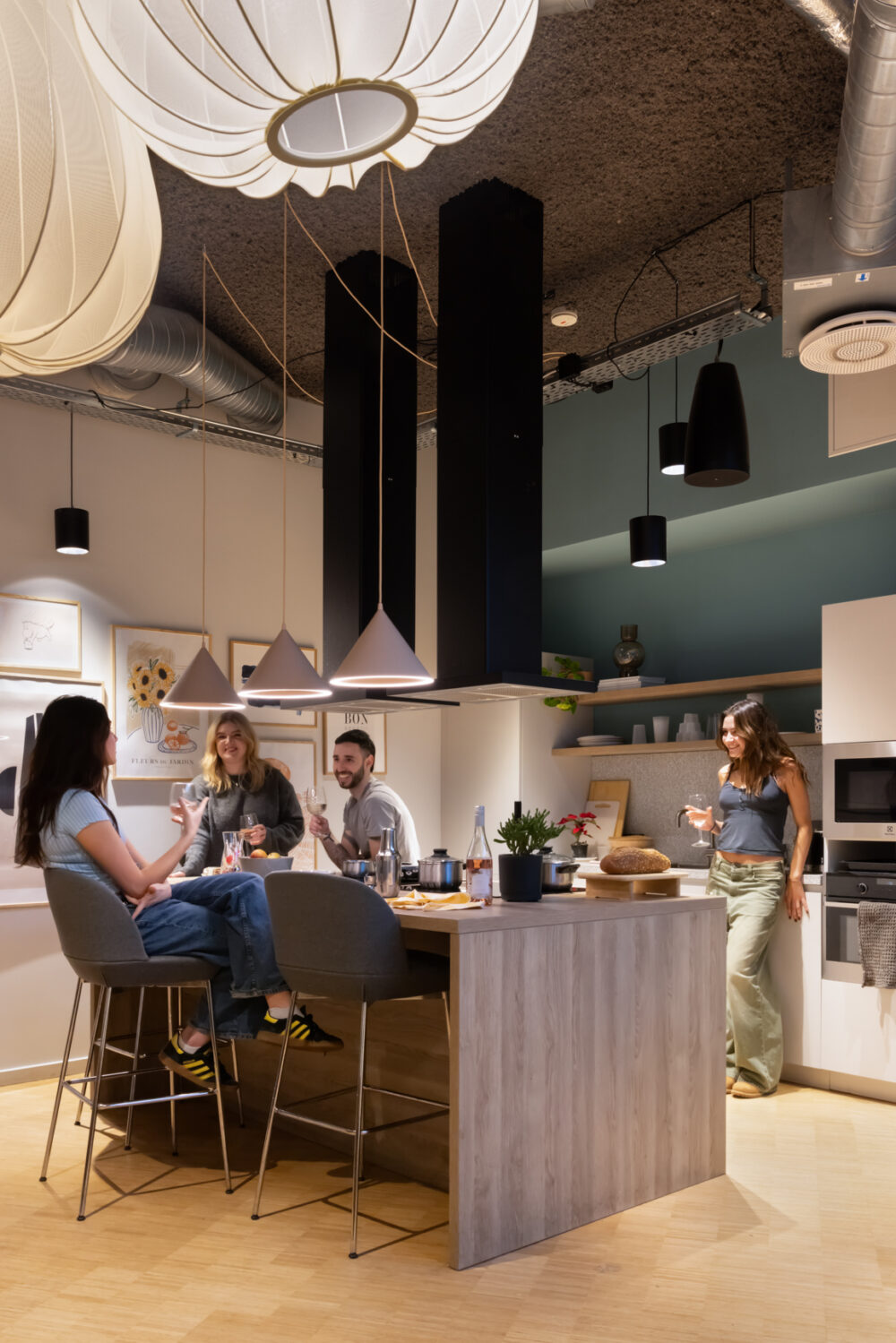 Private dining area with residents drinking and having a party in BaseStack student accommodation and apartments to rent in Copenhagen