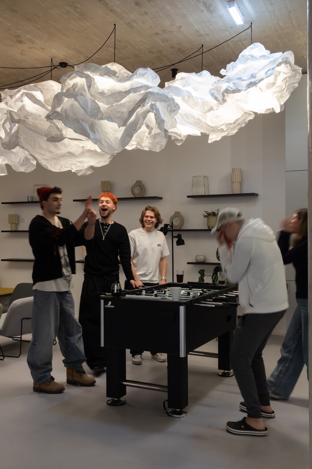 Group of students enjoying the open communal space at Milestone by Tribera Vienna