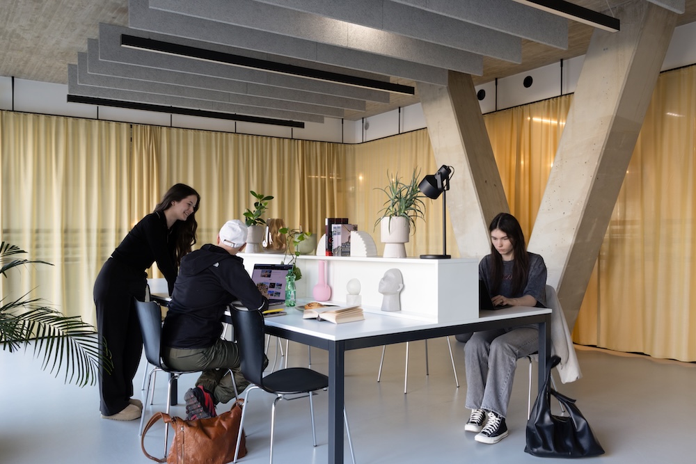 Residents gathering in the study room in Vienna student accommodation