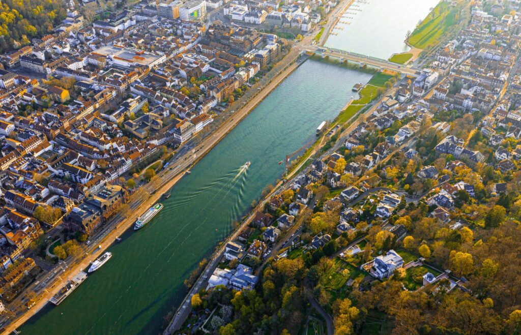 Aerial view of the river in Bonn and city visible on both sides.